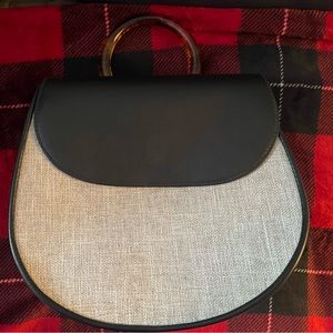 A New Day crescent shaped backpack